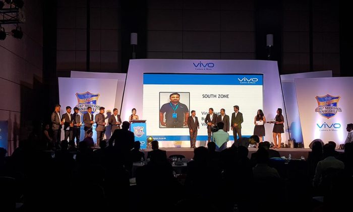 Awards presentation on stage under "Vivo Champions Night" branding, a "SOUTH ZONE" results slide displayed on screen.