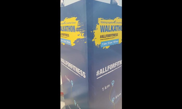 Signage pillar reading "WALKATHON #ALLFORFITNESS" with 1km/5km/10km route markers.