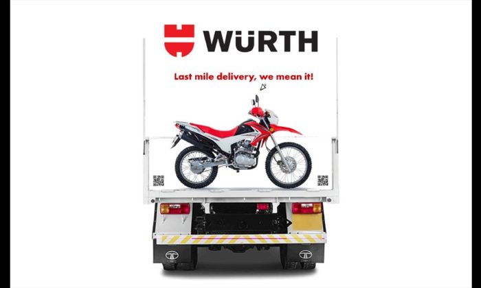 Design rendering of the rear of a WÜRTH-branded delivery truck reading "Last mile delivery, we mean it!" with a motorcycle graphic.